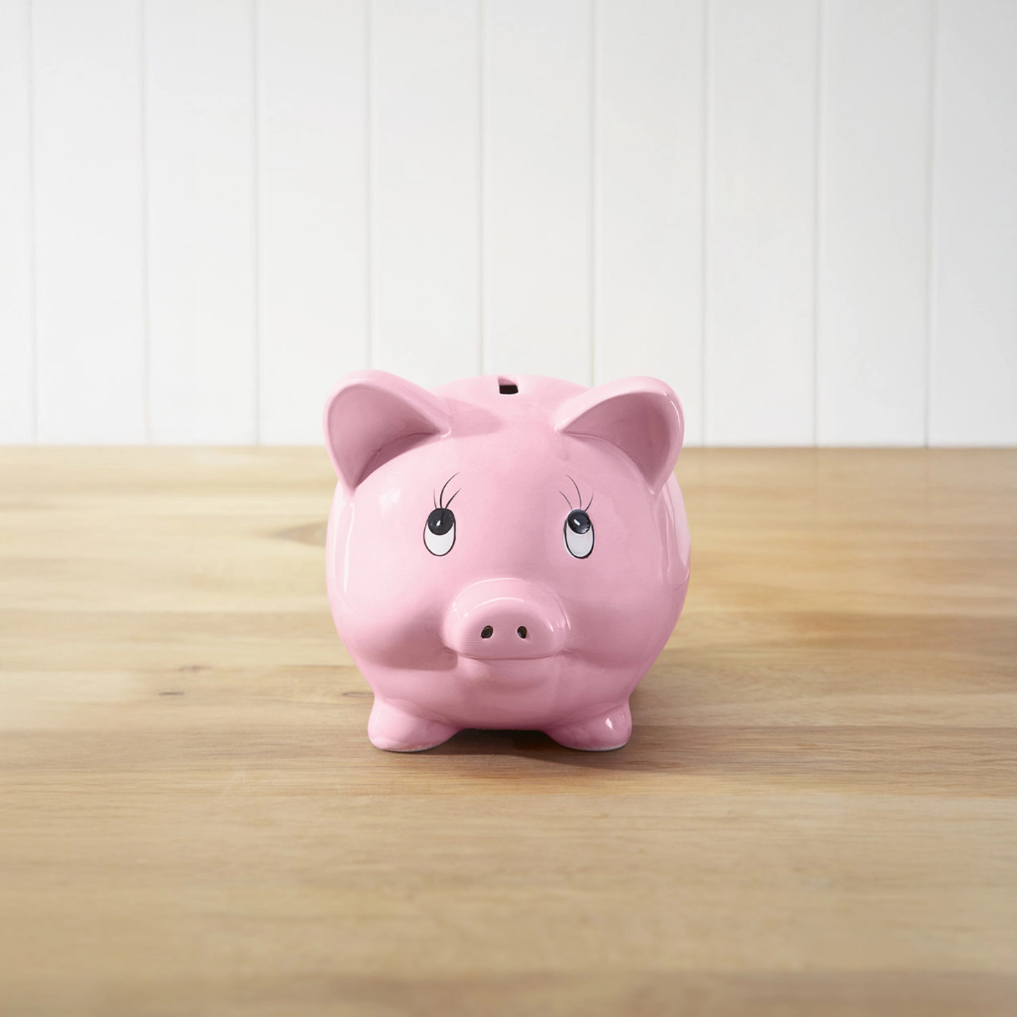 Piggy bank against a neutral background