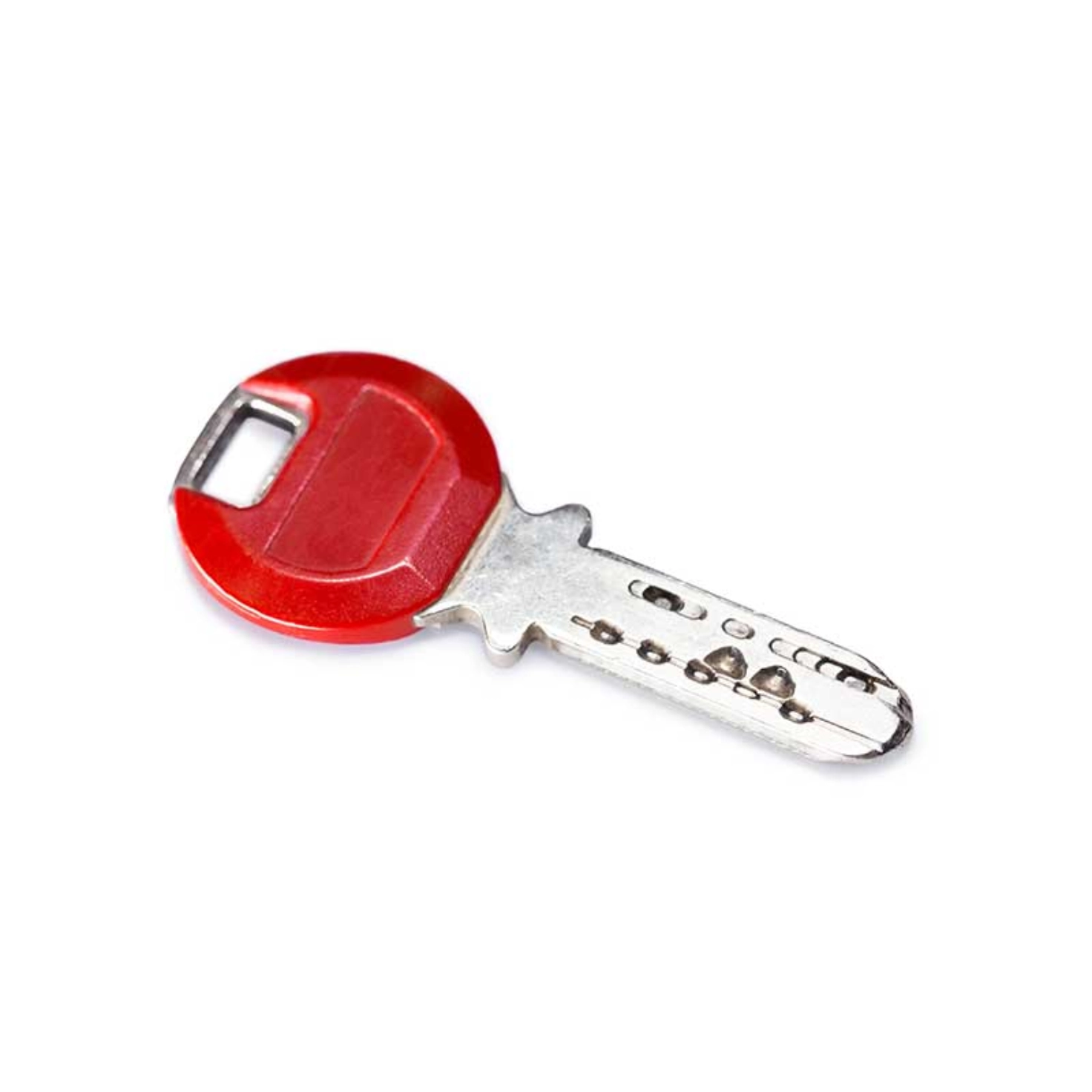 A car or flat key against a neutral background.