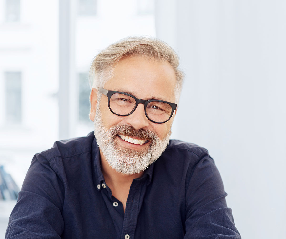 Man with glasses and grey hair